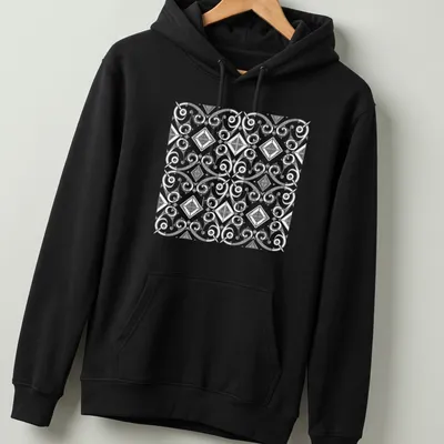 Black and white T-shirt featuring intricate African cultural patterns in geometric designs — printed on a unisex hoodie