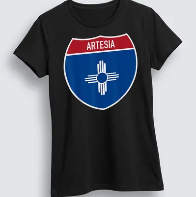 Bold graphic T-shirt featuring Arteisa highway sign in blue, red, and white — printed on a women's shirt