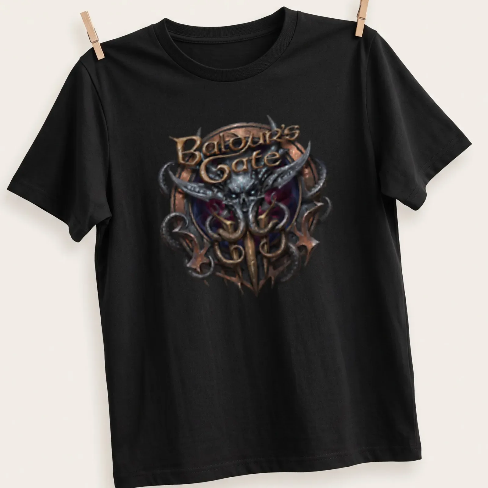 Emblem featuring the Baldur's Gate logo in gold, black, purple, and silver — printed on a unisex t-shirt