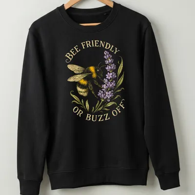 Illustrative print of a bee with the text 'BEE FRIENDLY OR BUZZ OFF' in yellow and lavender — printed on a unisex sweatshirt