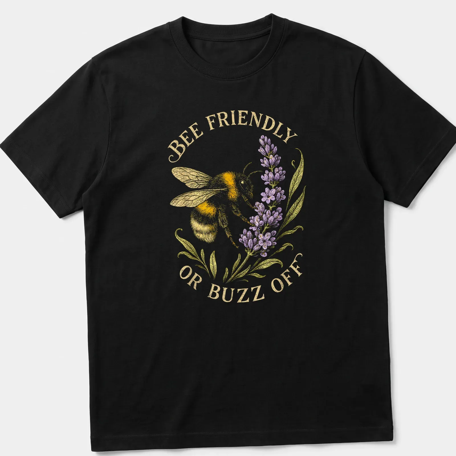 Illustrative print of a bee with the text 'BEE FRIENDLY OR BUZZ OFF' in yellow and lavender — printed on a unisex t-shirt