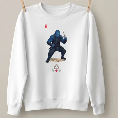 Illustration of a blue Bigfoot ninja wielding sai weapons with the word 'Ninja' — printed on a unisex sweatshirt
