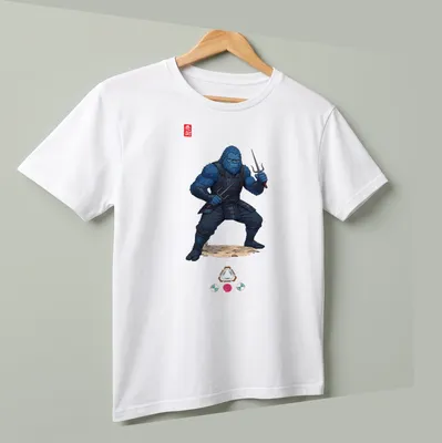 Illustration of a blue Bigfoot ninja wielding sai weapons with the word 'Ninja' — printed on a unisex t-shirt (angled view)