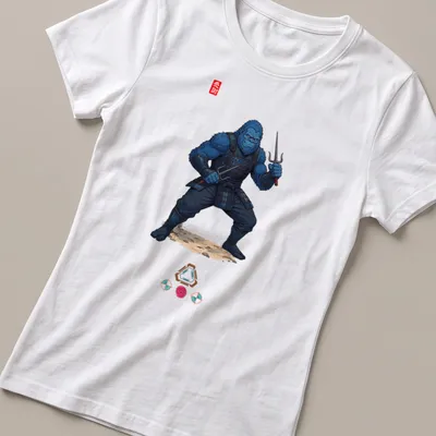 Illustration of a blue Bigfoot ninja wielding sai weapons with the word 'Ninja' — printed on a women's shirt