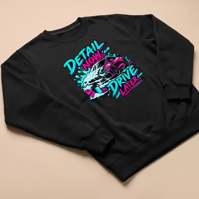 Bold graphic t-shirt featuring a car wash scene with foam and playful text — printed on a unisex sweatshirt