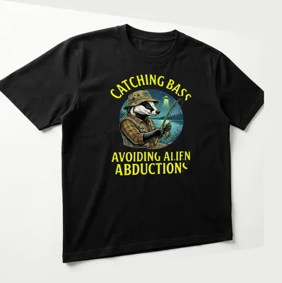 Colorful cartoon of a badger fisherman with funny text about alien abductions — printed on a unisex t-shirt (angled view)