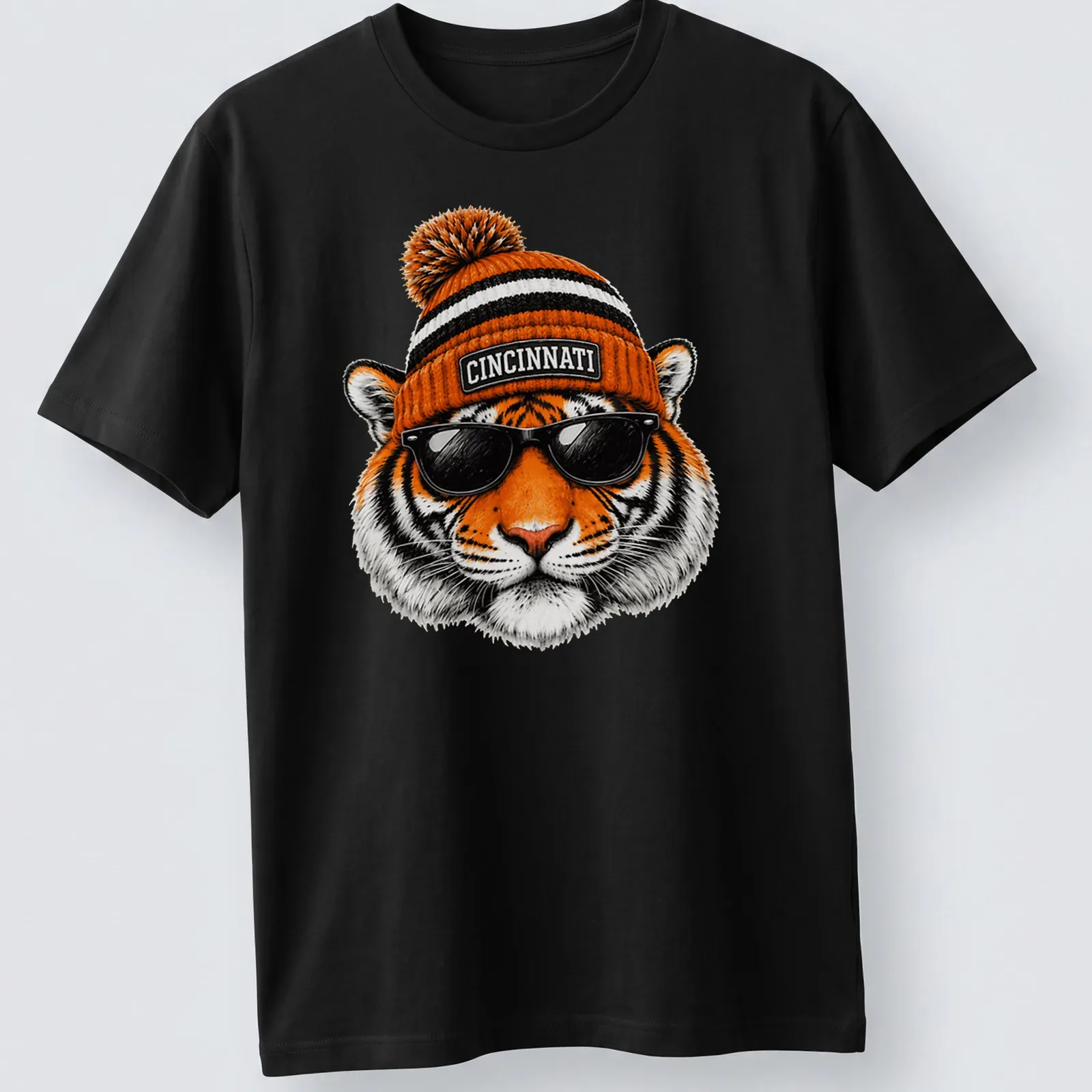 Realistic tiger wearing sunglasses and a beanie with Cincinnati text above. — printed on a unisex t-shirt