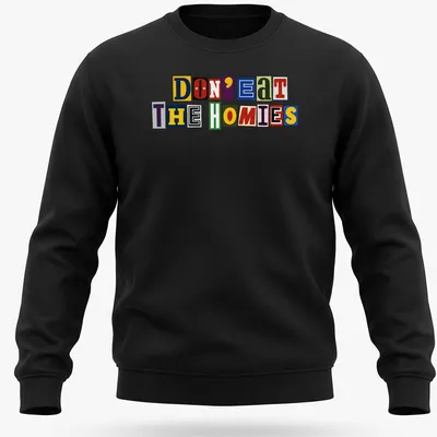 Colorful ransom note typography on a vegan-themed shirt, reading 'Don't Eat The Homies' in vibrant hues. — printed on a unisex sweatshirt