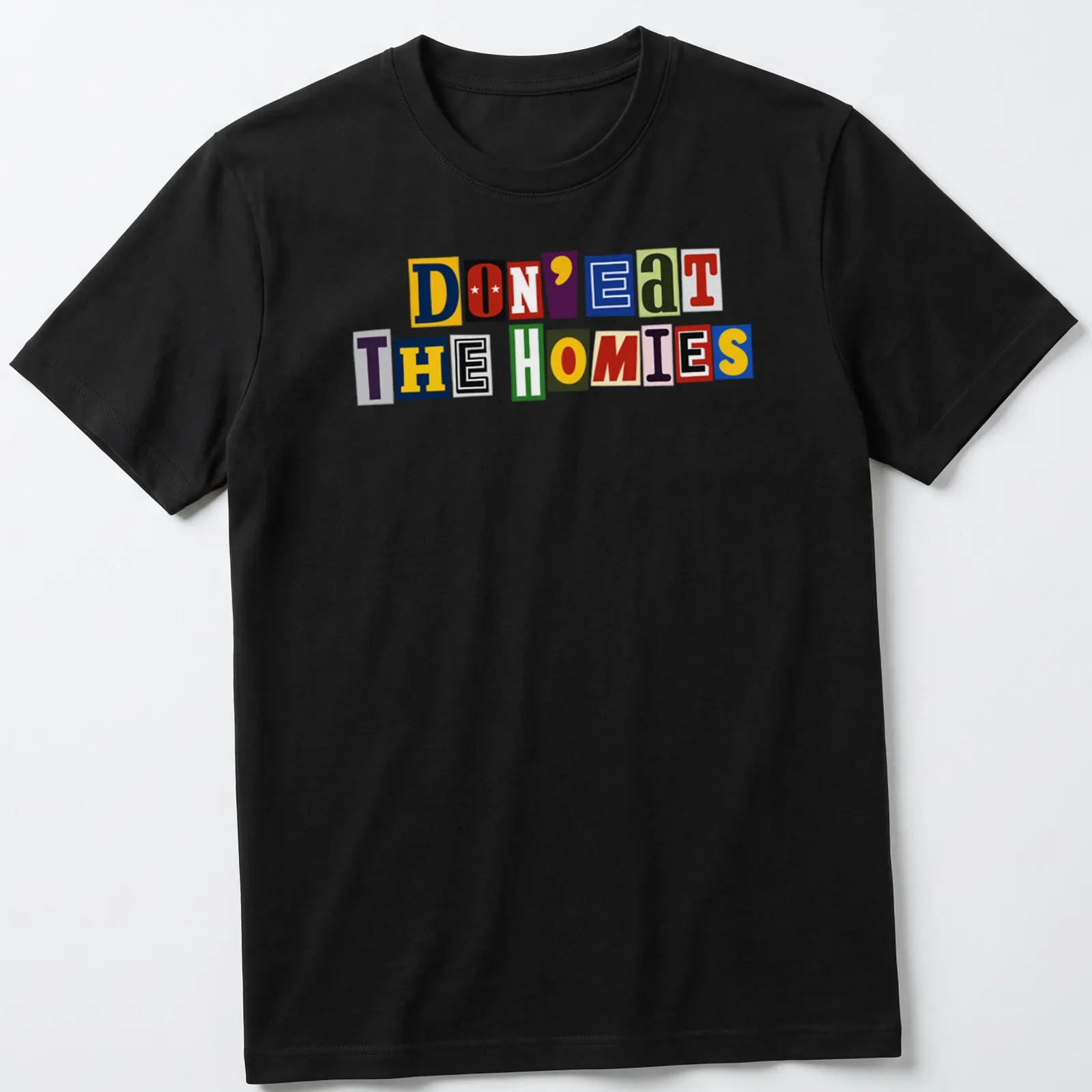 Colorful ransom note typography on a vegan-themed shirt, reading 'Don't Eat The Homies' in vibrant hues. — printed on a unisex t-shirt
