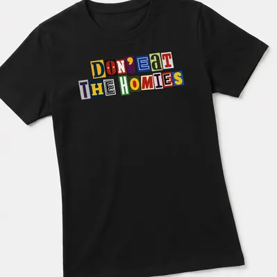 Colorful ransom note typography on a vegan-themed shirt, reading 'Don't Eat The Homies' in vibrant hues. — printed on a women's shirt