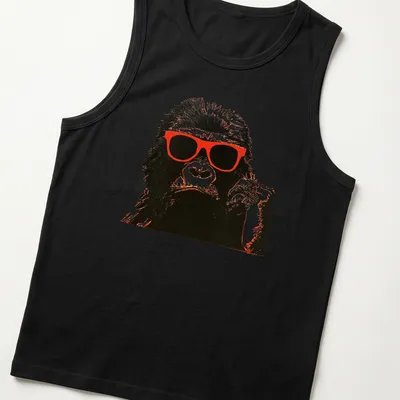 Vintage design of a chimpanzee in red sunglasses against a black and white background. — printed on a tank top