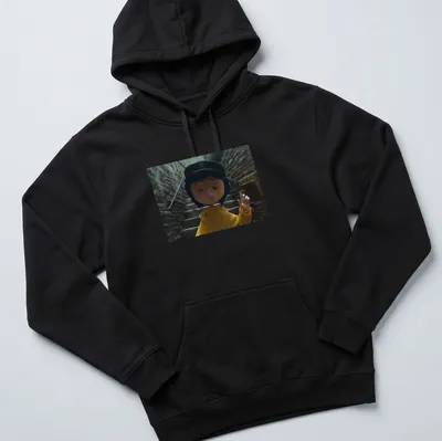 Coraline in a yellow raincoat surrounded by a whimsical background in 3D animation style — printed on a unisex hoodie