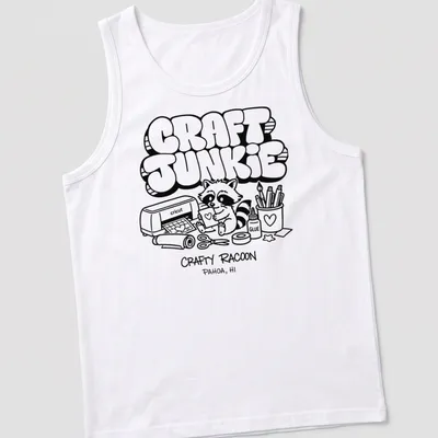 Cartoon raccoon graphic with text 'CRAFT JUNKIE CRAFTY RACOON PAHOA, HI' in black and white — printed on a tank top
