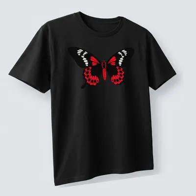 Cartoon style Crimson Rose Butterfly in black, red, and white colors — printed on a unisex t-shirt (angled view)