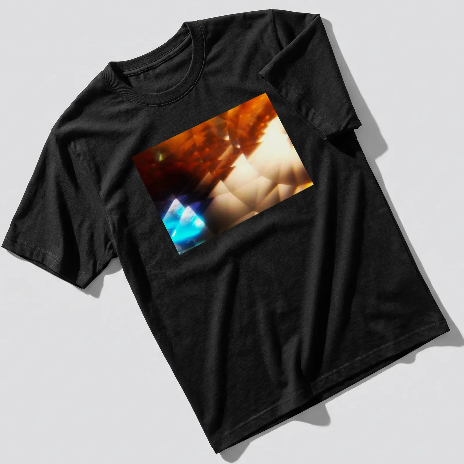 Abstract illustration of a crystalline prism with amber and blue pyramids — printed on a unisex t-shirt