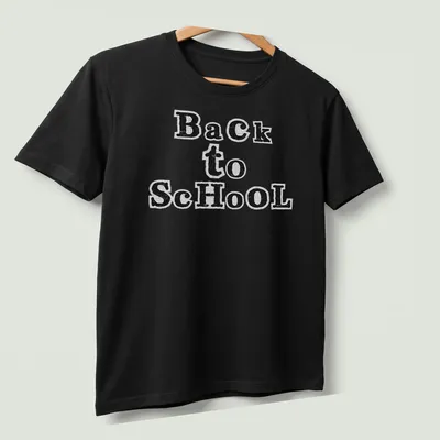Black and white cut paper collage typography t-shirt featuring 'Back to School' text. — printed on a unisex t-shirt (angled view)