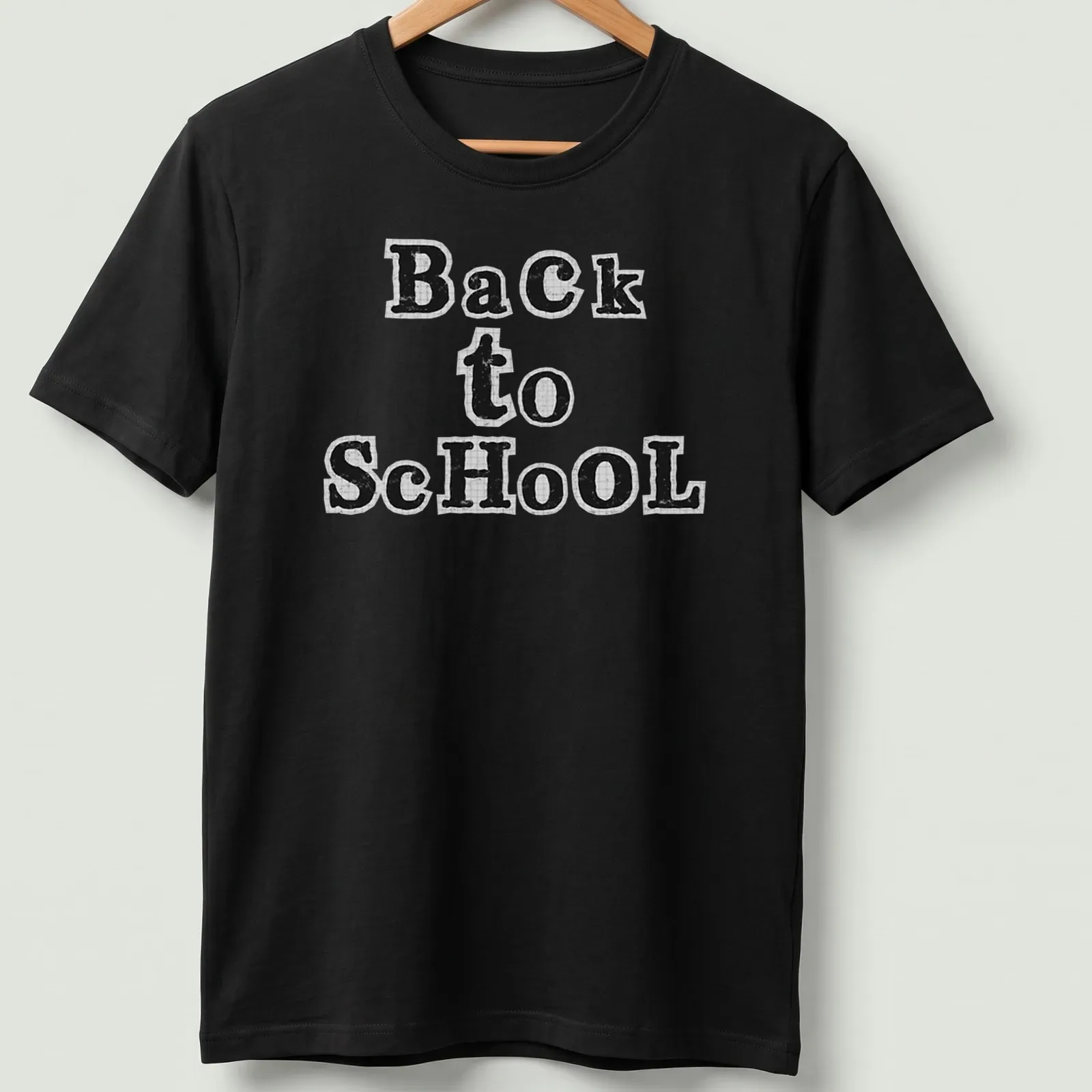 Black and white cut paper collage typography t-shirt featuring 'Back to School' text. — printed on a unisex t-shirt