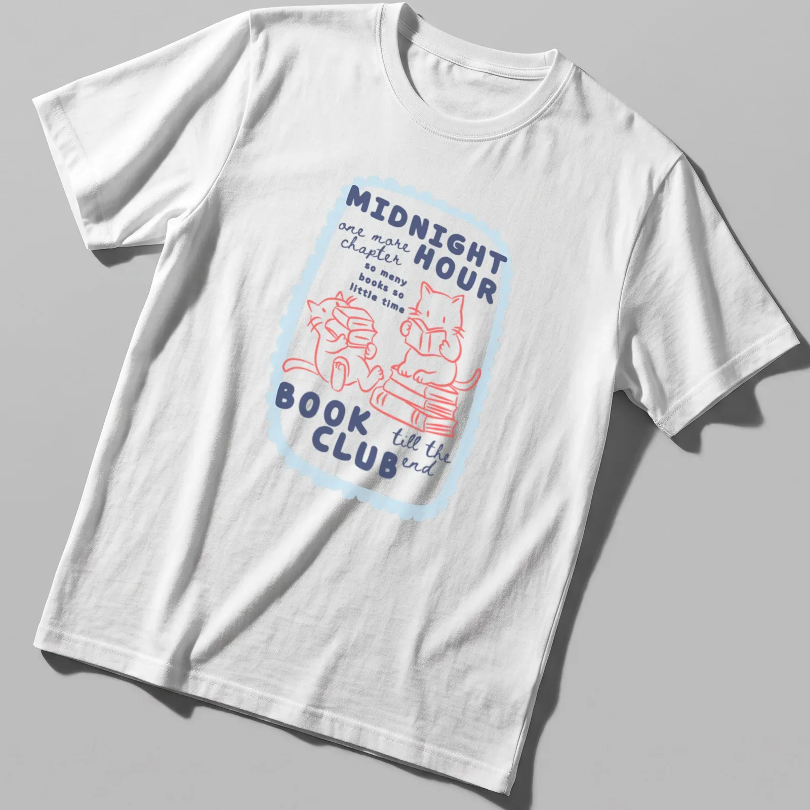 Kawaii style design of cute cats reading books in pastel colors — printed on a unisex t-shirt