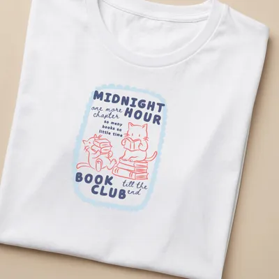 Kawaii style design of cute cats reading books in pastel colors — printed on a women's shirt