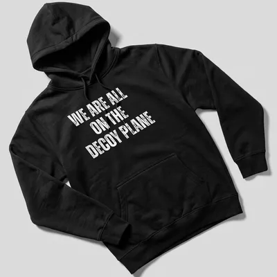 Bold typography on a t-shirt with the slogan 'WE ARE ALL ON THE DECoy PLANE' in white. — printed on a unisex hoodie