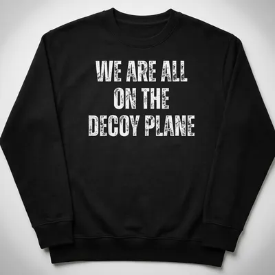 Bold typography on a t-shirt with the slogan 'WE ARE ALL ON THE DECoy PLANE' in white. — printed on a unisex sweatshirt