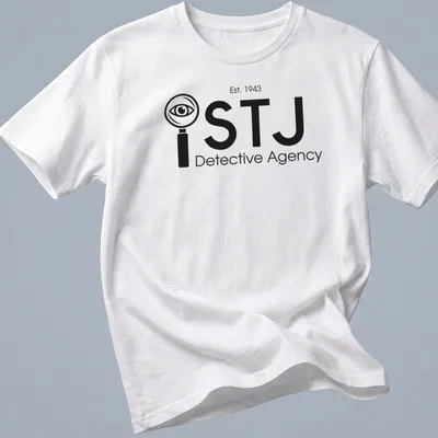Modern minimalist Detective Agency t-shirt featuring magnifying glass and eye design in black and white