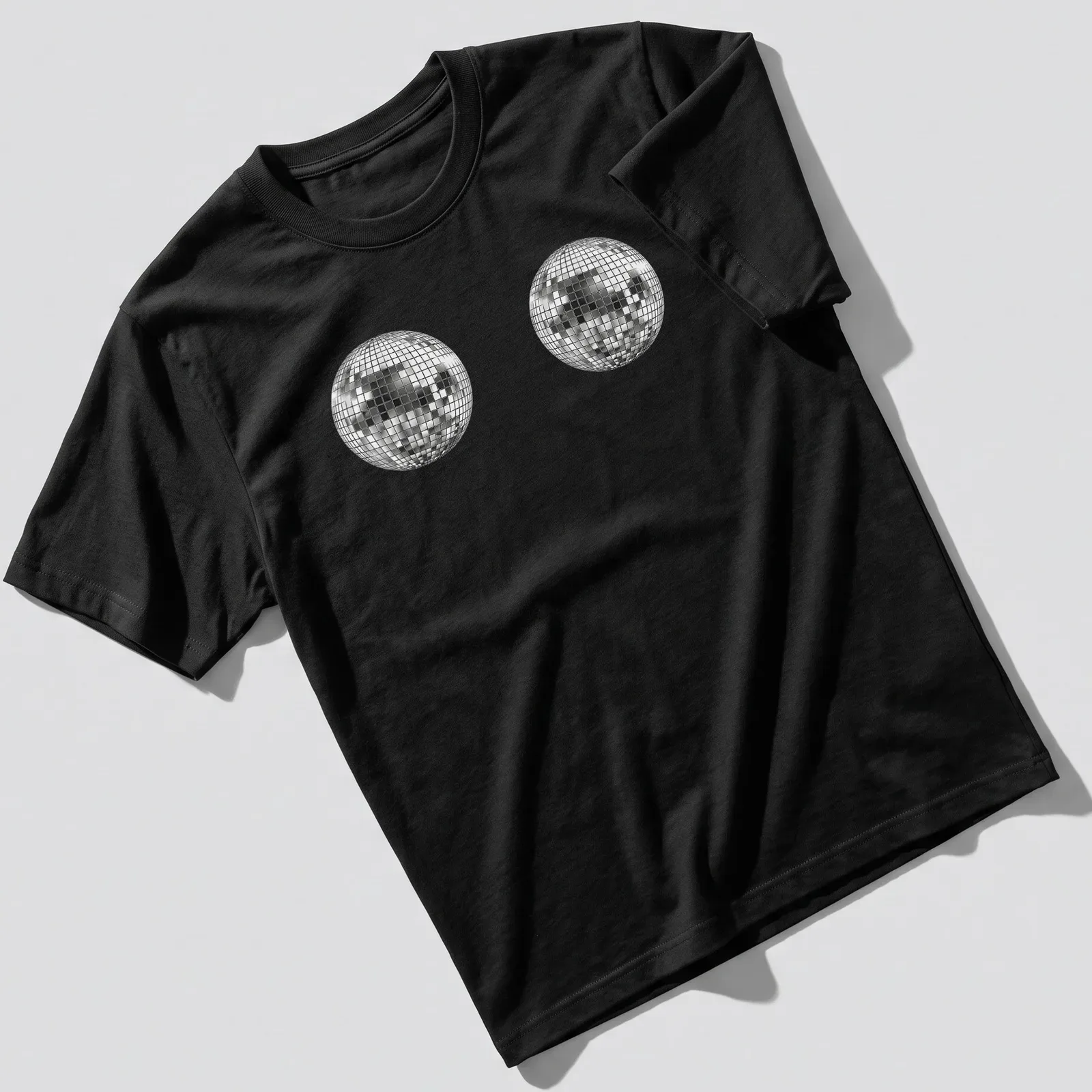 Vector illustration of a cute disco ball in silver, black, and white — printed on a unisex t-shirt