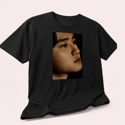 Realistic portrait of a male figure with detailed skin tones — printed on a unisex t-shirt (angled view)