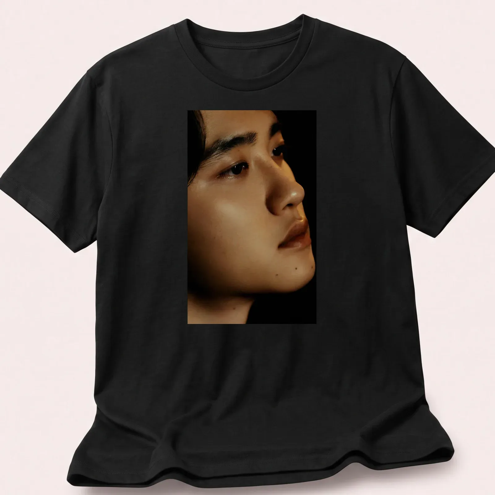 Realistic portrait of a male figure with detailed skin tones — printed on a unisex t-shirt