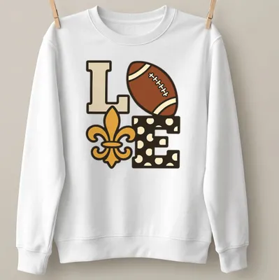 Playful illustration of football with 'Love Our Saints' text in brown and gold. — printed on a unisex sweatshirt