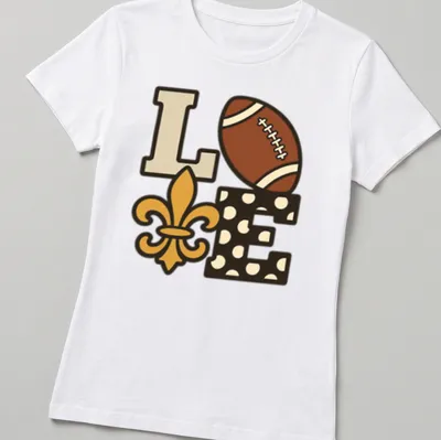Playful illustration of football with 'Love Our Saints' text in brown and gold. — printed on a women's shirt