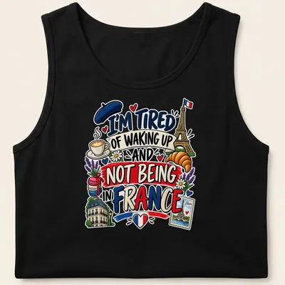 Colorful cartoon of Eiffel Tower, croissant, and coffee with text about France — printed on a tank top