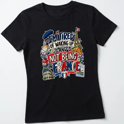 Colorful cartoon of Eiffel Tower, croissant, and coffee with text about France — printed on a women's shirt