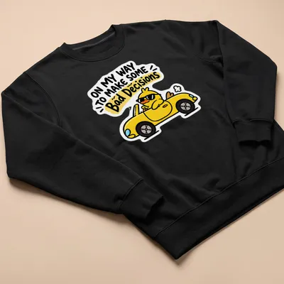 Cartoon duck driving a yellow car with humorous text about bad decisions — printed on a unisex sweatshirt