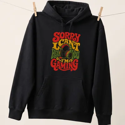 Retro distressed tee with a gaming headset and text: Sorry I Can't Hear You I'm Gaming. — printed on a unisex hoodie