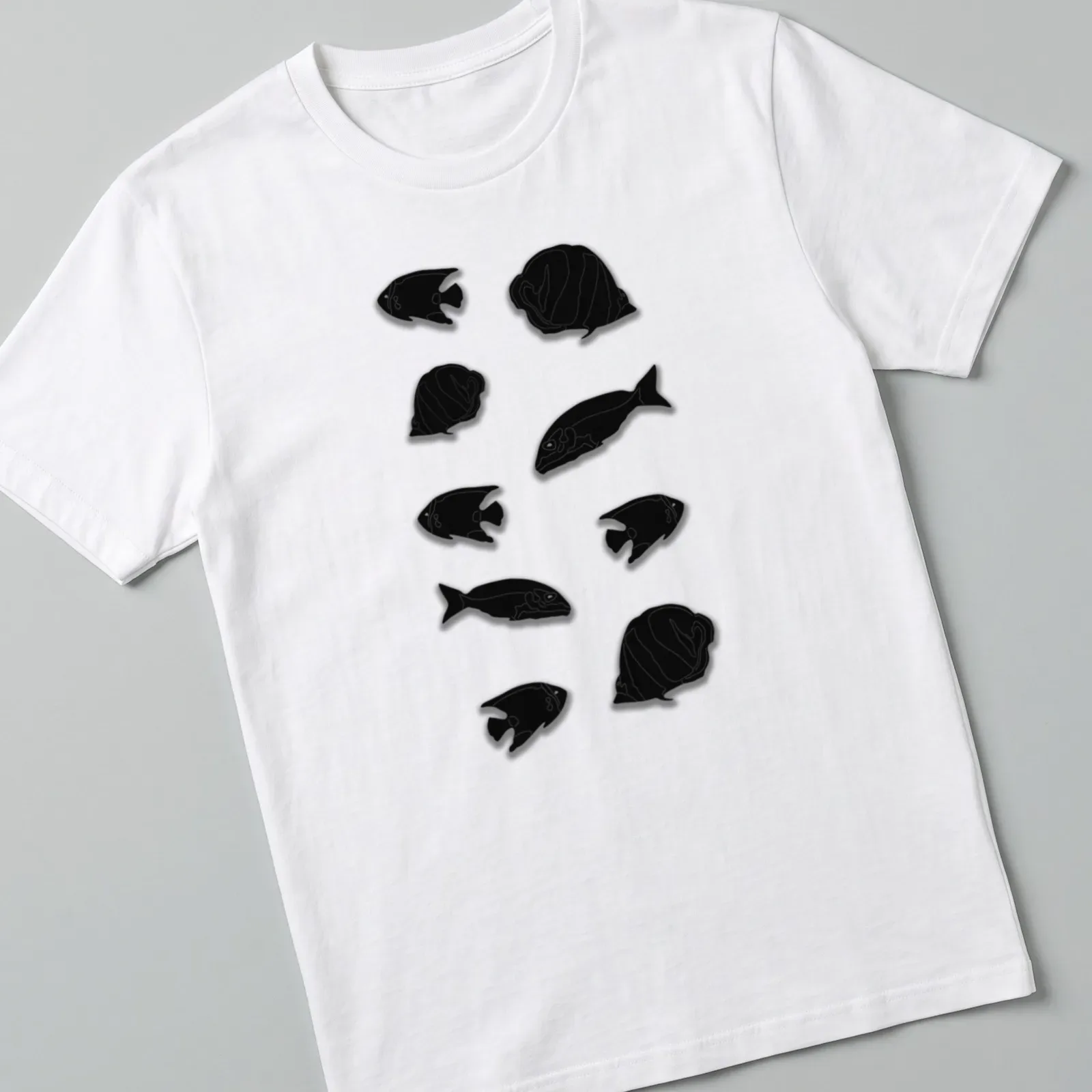 Simple black silhouette of a group of fish on a — printed on a unisex t-shirt