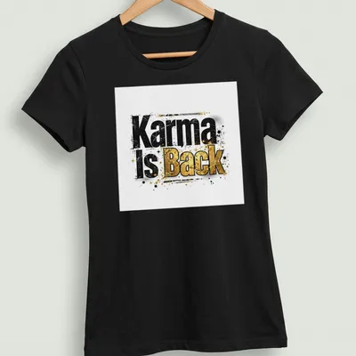 Grunge typography t-shirt featuring the phrase Karma Is Back in bold black, gold, and white — printed on a women's shirt