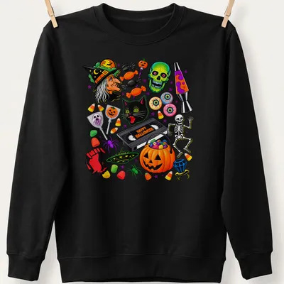 Colorful cartoon Halloween shirt featuring a black cat, pumpkin, and skull with Happy Halloween text — printed on a unisex sweatshirt