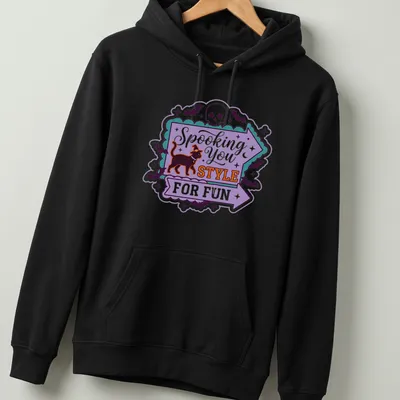 Playful Halloween-themed t-shirt featuring a black cat in a witch hat with colorful text. — printed on a unisex hoodie