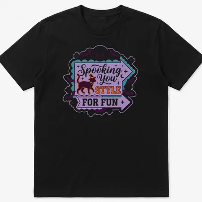 Playful Halloween-themed t-shirt featuring a black cat in a witch hat with colorful text.