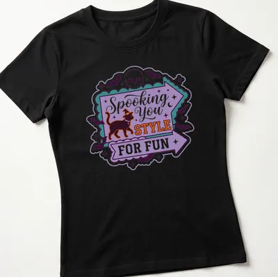 Playful Halloween-themed t-shirt featuring a black cat in a witch hat with colorful text. — printed on a women's shirt