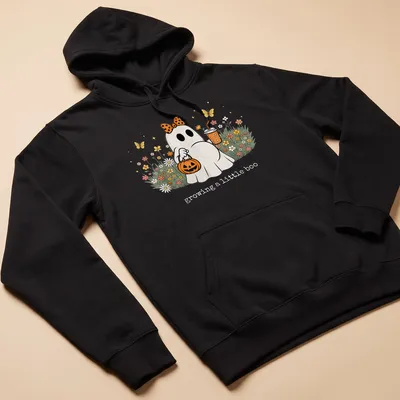 Kawaii Halloween ghost with the text 'growing a little boo' in bright colors. — printed on a unisex hoodie