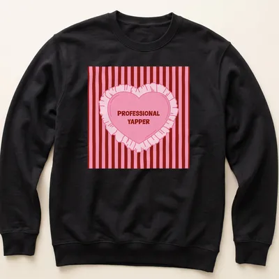 Cartoon heart design with humorous Professional Yapper text in pink and red — printed on a unisex sweatshirt
