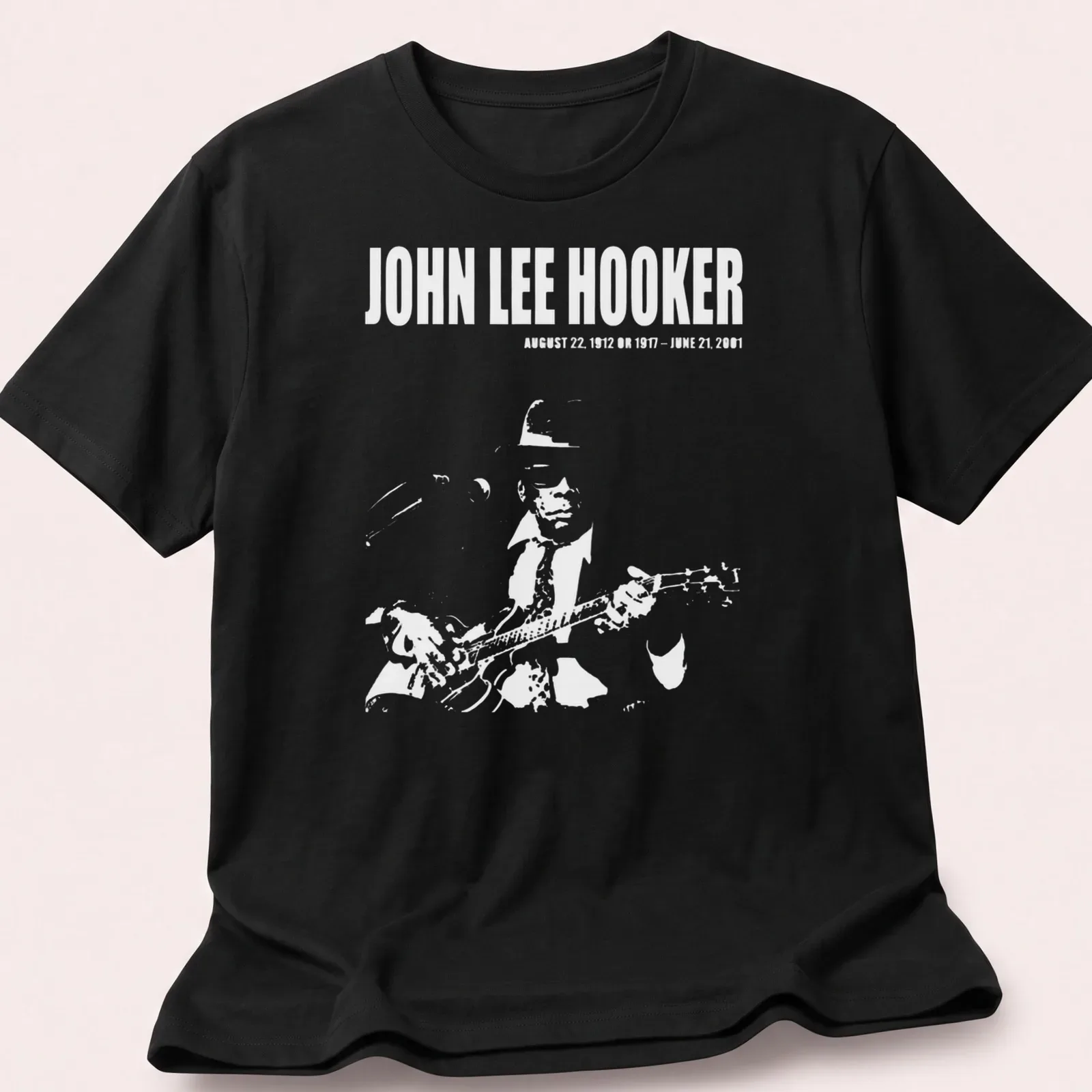 Vintage portrait of John Lee Hooker with text about his life dates in black, white, and gray. — printed on a unisex t-shirt