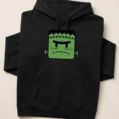Kawaii style Frankenstein monster with a smile and playful colors — printed on a unisex hoodie
