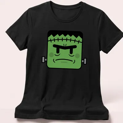 Kawaii style Frankenstein monster with a smile and playful colors — printed on a women's shirt