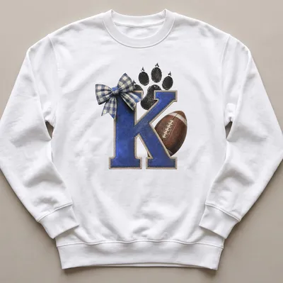 Vintage distressed shirt featuring a letter K, football, and paw print in blue and brown — printed on a unisex sweatshirt