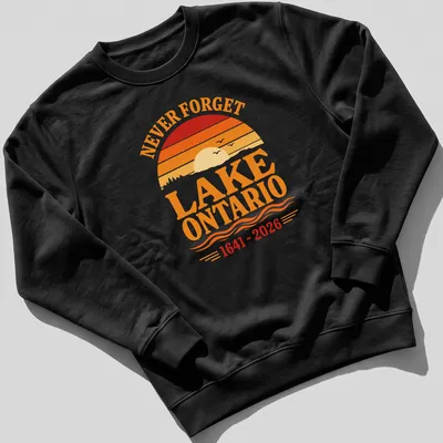 Vintage sunset graphic featuring Lake Ontario with 'NEVER FORGET LAKE ONTARIO 1641 - 2026' text. — printed on a unisex sweatshirt