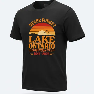 Vintage sunset graphic featuring Lake Ontario with 'NEVER FORGET LAKE ONTARIO 1641 - 2026' text. — printed on a unisex t-shirt