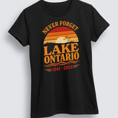 Vintage sunset graphic featuring Lake Ontario with 'NEVER FORGET LAKE ONTARIO 1641 - 2026' text. — printed on a women's shirt